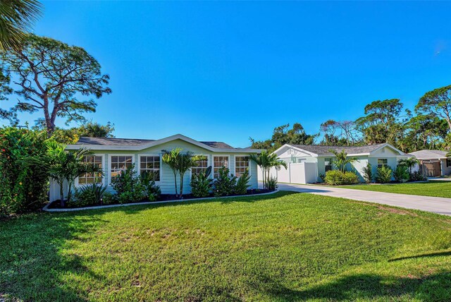 ranch-style house with a front yard