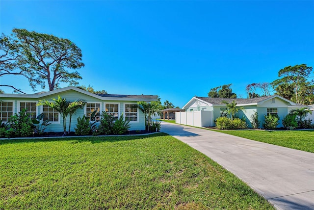 single story home featuring a front yard