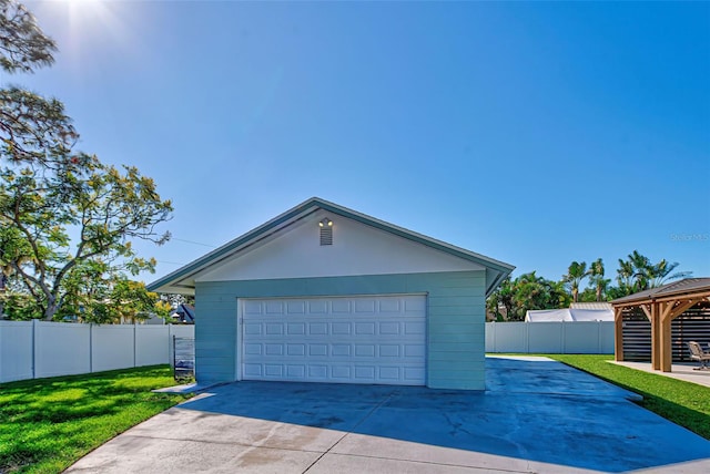 exterior space with a front yard and a garage