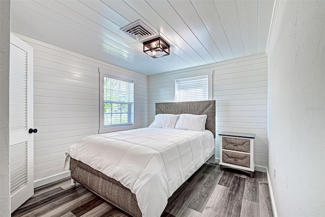 bedroom featuring dark hardwood / wood-style flooring