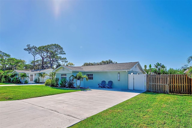 ranch-style home with a front yard