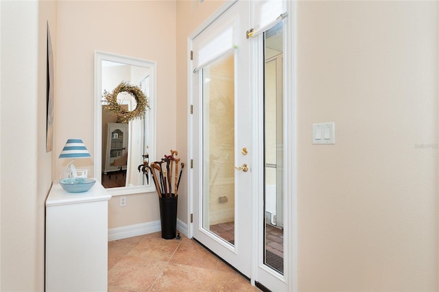 corridor featuring light tile floors