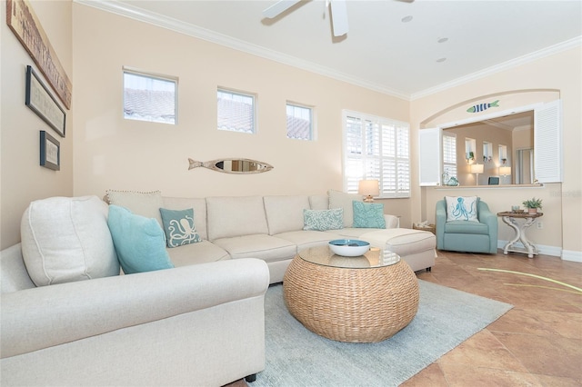 living room with light tile flooring, ceiling fan, and crown molding