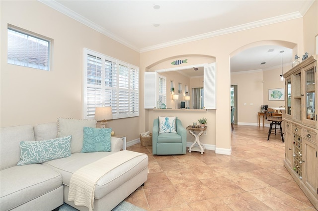 sitting room with ornamental molding and light tile floors