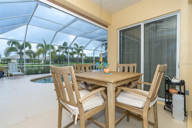 sunroom featuring lofted ceiling