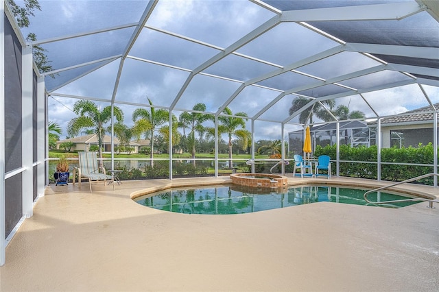 view of swimming pool featuring a patio, a lanai, and an in ground hot tub