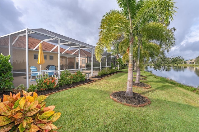 view of yard featuring a lanai, a water view, and a swimming pool