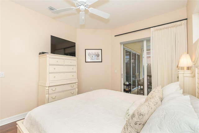 bedroom featuring access to exterior, ceiling fan, and hardwood / wood-style flooring