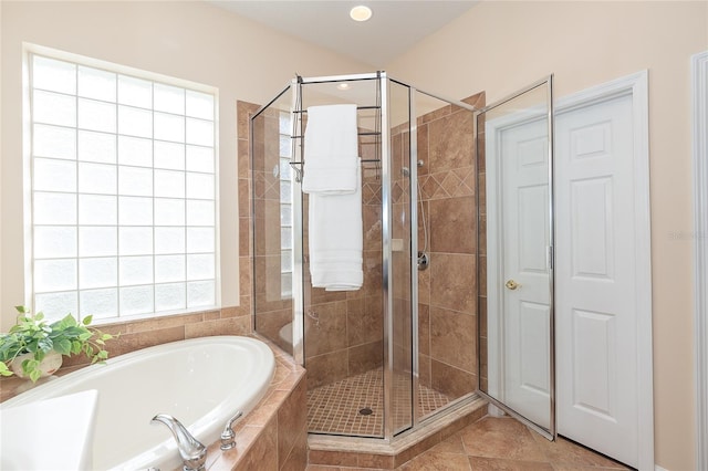 bathroom with separate shower and tub and tile flooring