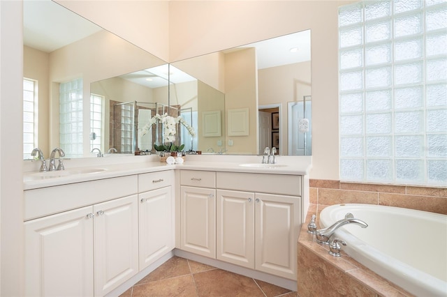 bathroom featuring plus walk in shower, tile flooring, and dual vanity