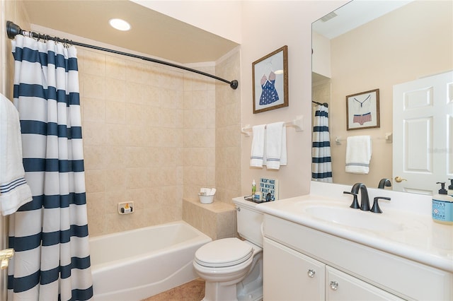 full bathroom featuring toilet, large vanity, and shower / tub combo with curtain