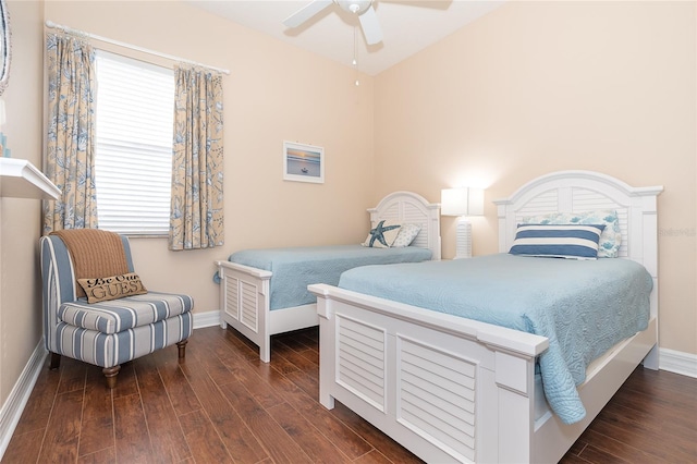 bedroom with ceiling fan and dark wood-type flooring