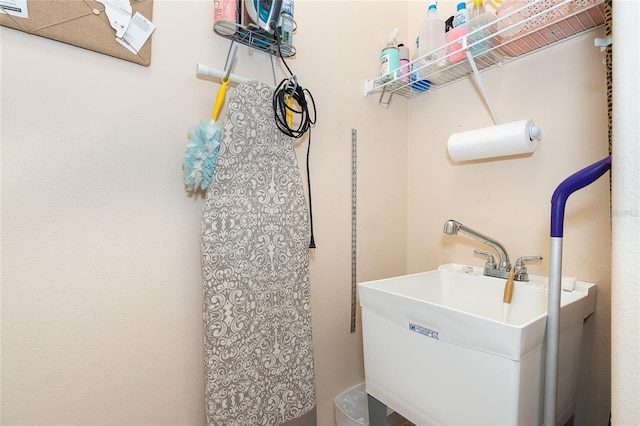 clothes washing area with sink