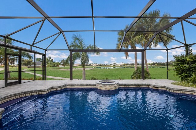 view of swimming pool with glass enclosure, a yard, and an in ground hot tub