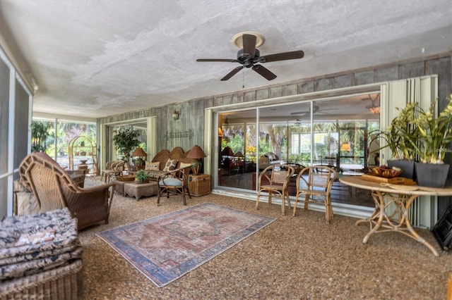 sunroom with ceiling fan and a healthy amount of sunlight