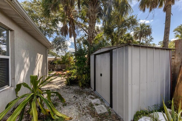 view of shed with fence