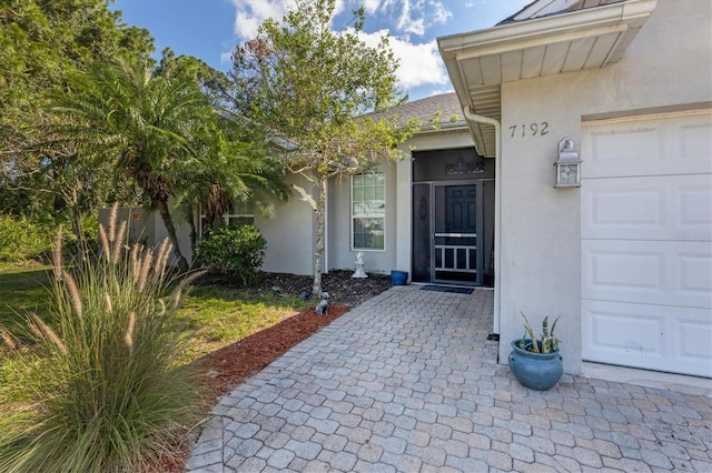 doorway to property featuring a garage