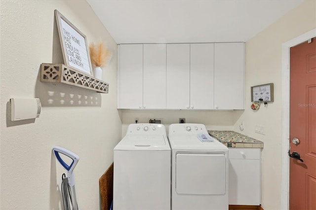 laundry area with cabinet space and washing machine and dryer