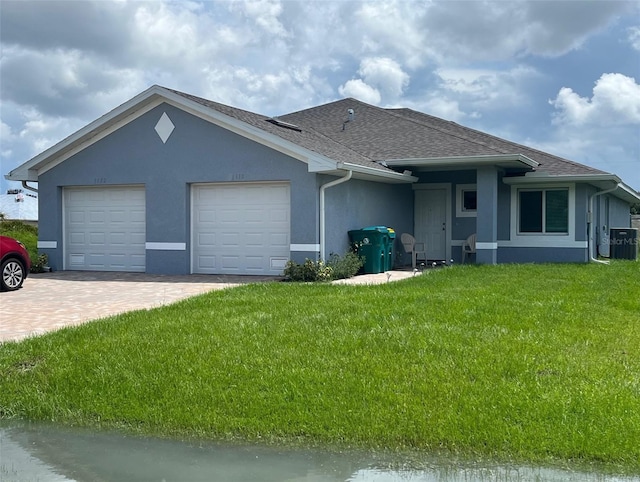 single story home with a front lawn, a garage, and central AC unit