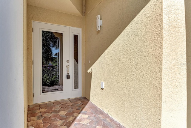 entrance to property featuring french doors