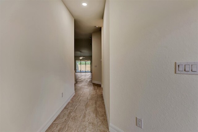 hall with light tile floors