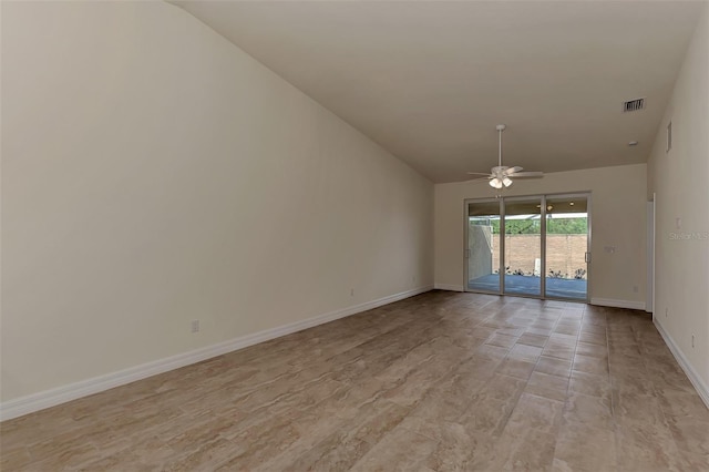 empty room featuring ceiling fan and lofted ceiling