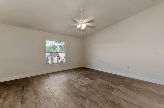 unfurnished room featuring vaulted ceiling and ceiling fan