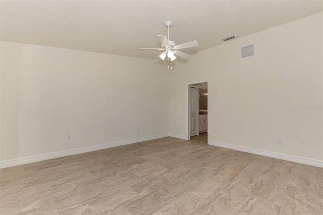 empty room with light tile floors and ceiling fan