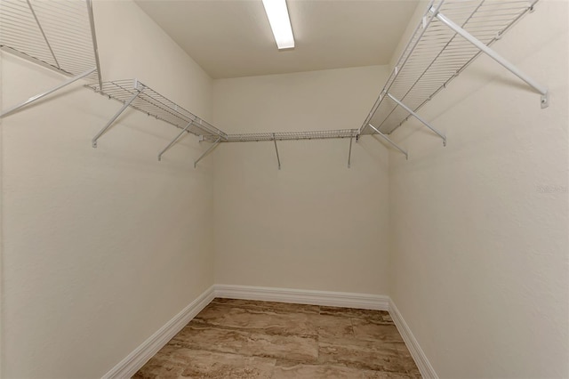 walk in closet featuring light wood-type flooring