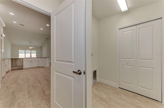 hallway featuring light tile floors