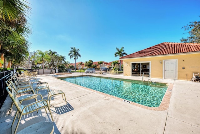 view of swimming pool featuring a patio area