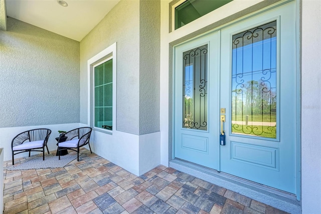 doorway to property featuring a porch