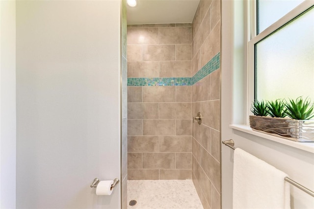 bathroom featuring tiled shower