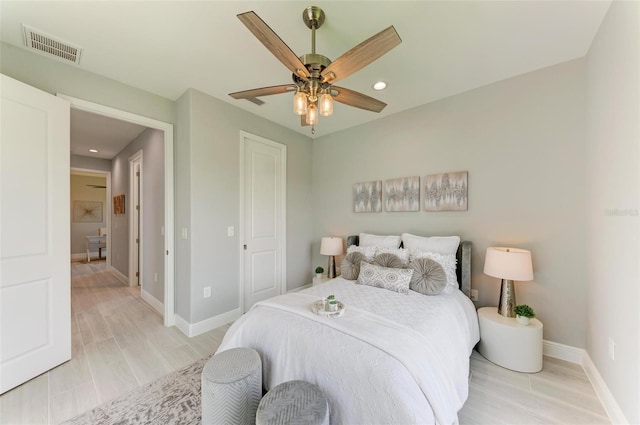 bedroom featuring light hardwood / wood-style floors and ceiling fan