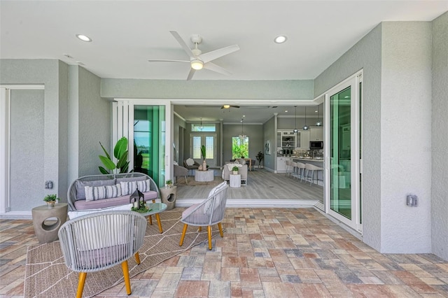 view of patio featuring outdoor lounge area and ceiling fan