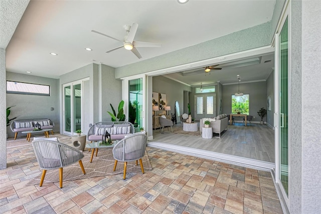 view of terrace with french doors, an outdoor hangout area, and ceiling fan