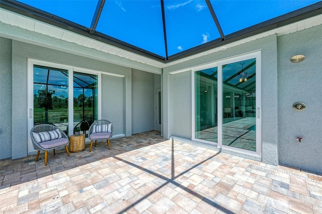 view of terrace with a lanai