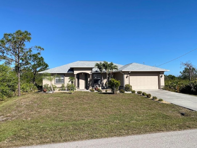 view of front facade featuring a front yard and a garage