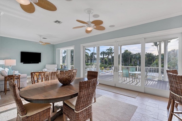 dining area featuring french doors and ornamental molding