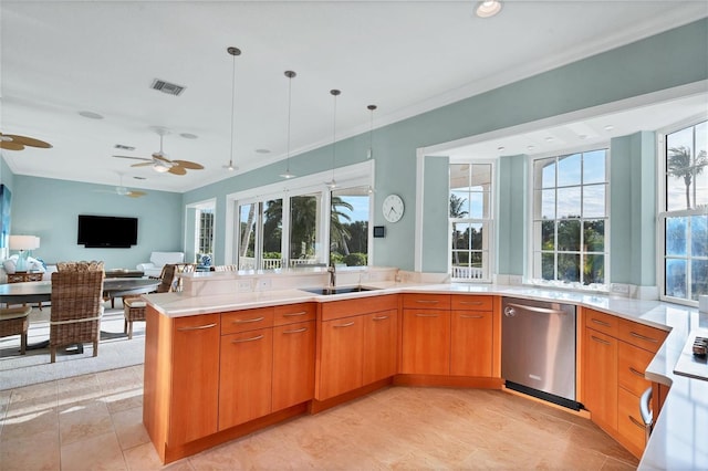 kitchen with pendant lighting, dishwasher, plenty of natural light, and sink