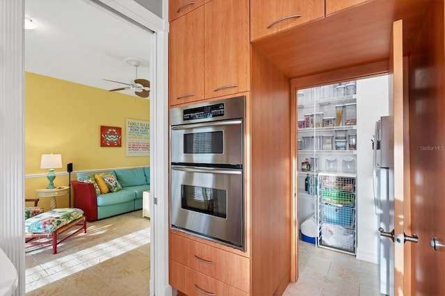 kitchen featuring ceiling fan and stainless steel appliances