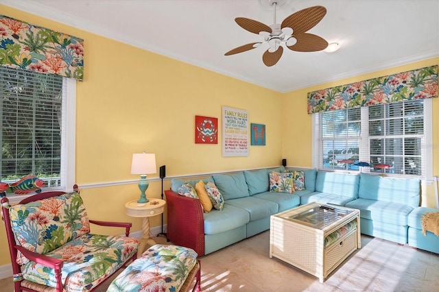 living room with ceiling fan and ornamental molding