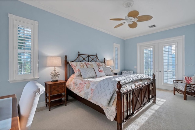 carpeted bedroom featuring ceiling fan, ornamental molding, access to outside, and multiple windows