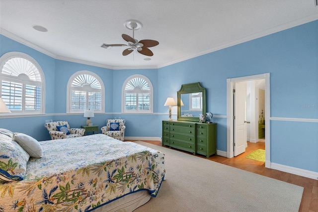 bedroom featuring ceiling fan, ornamental molding, and light hardwood / wood-style flooring