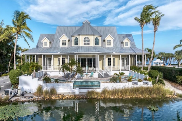 back of house with a water view