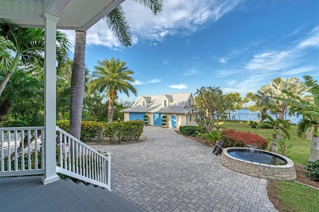 view of patio with a water view