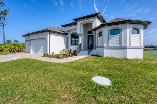 view of front facade featuring a front lawn and a garage