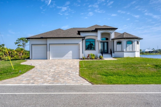 view of front facade featuring a garage and a front lawn