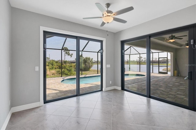 entryway featuring ceiling fan and light tile flooring