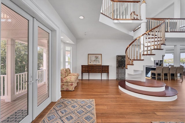 foyer entrance with hardwood / wood-style floors and french doors